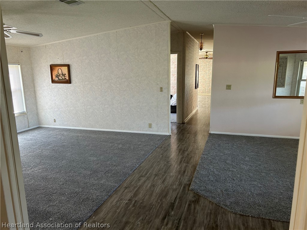 337 Hickory Ridge Drive Sebring, FL 33876 - Photo 18 of 48 an empty room with wooden floor and windows