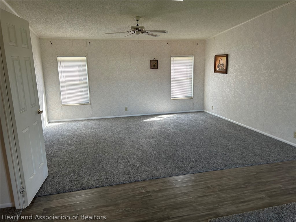 337 Hickory Ridge Drive Sebring, FL 33876 - Photo 19 of 48 an empty room with wooden floor and windows