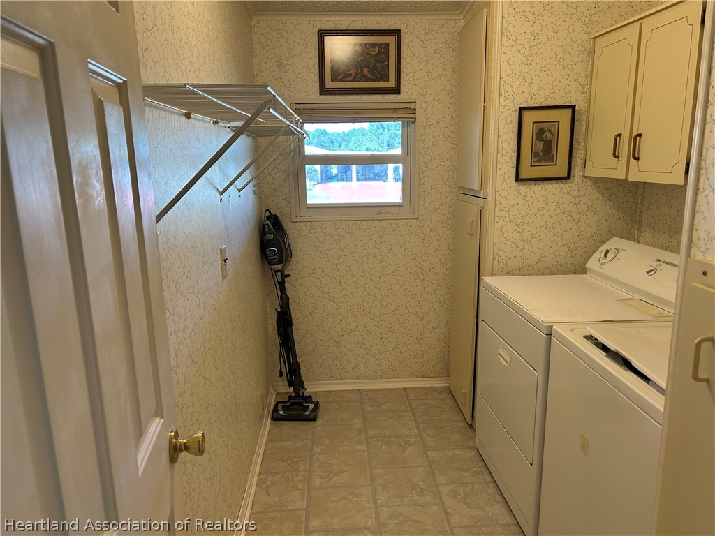 337 Hickory Ridge Drive Sebring, FL 33876 - Photo 22 of 48 a utility room with closet dryer and washer