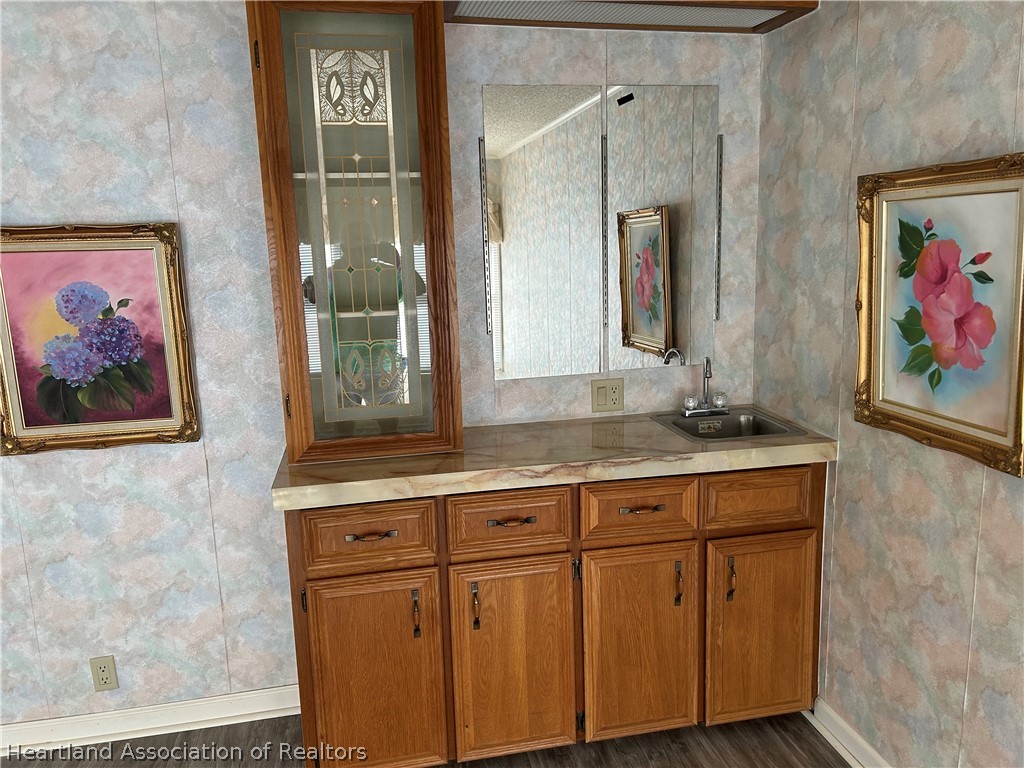 337 Hickory Ridge Drive Sebring, FL 33876 - Photo 26 of 48 a bathroom with a sink a vanity and a mirror