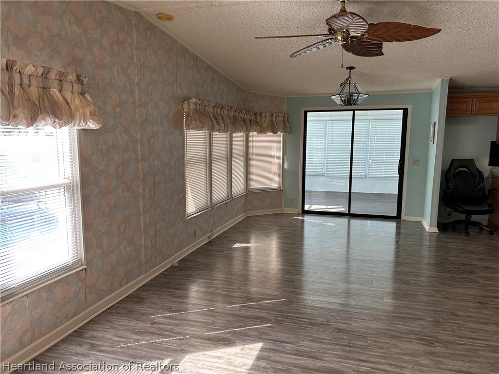 337 Hickory Ridge Drive Sebring, FL 33876 - Photo 27 of 48 a view of livingroom and hardwood floor