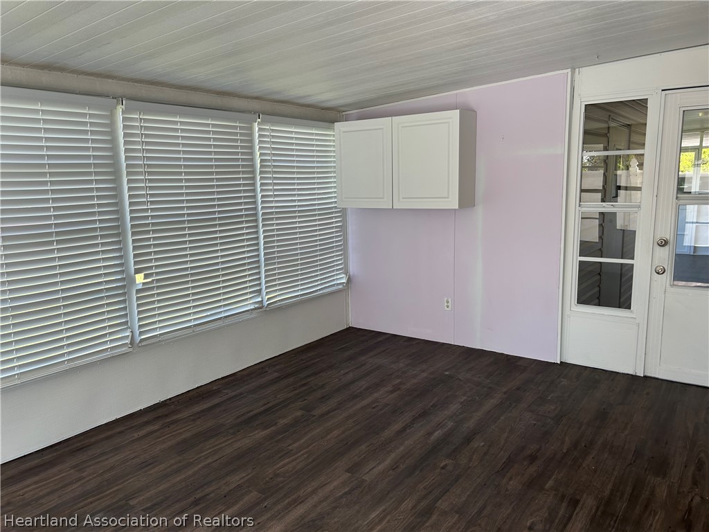 337 Hickory Ridge Drive Sebring, FL 33876 - Photo 29 of 48 an empty room with wooden floor and windows