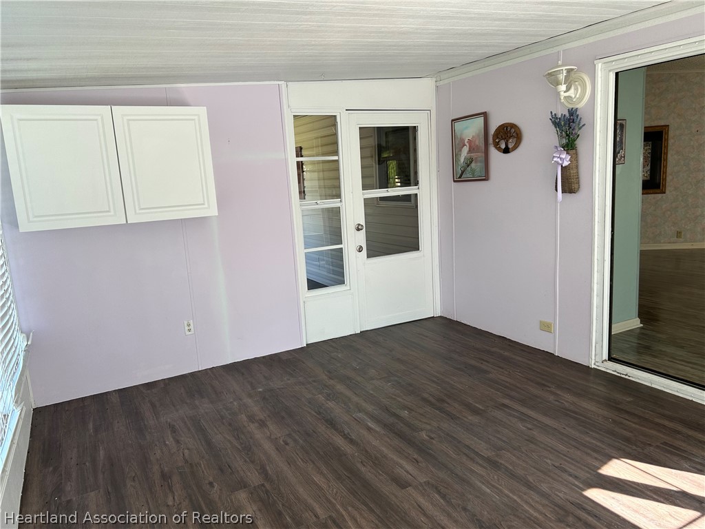 337 Hickory Ridge Drive Sebring, FL 33876 - Photo 30 of 48 a view of an entryway with wooden floor