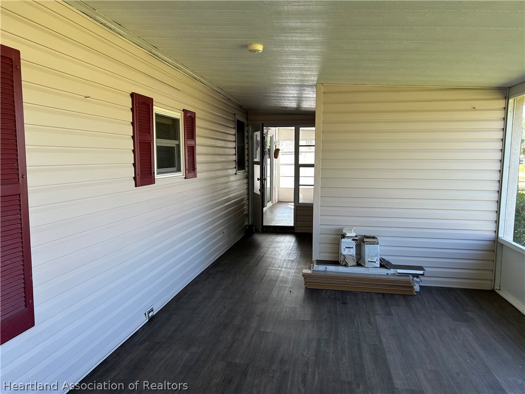 337 Hickory Ridge Drive Sebring, FL 33876 - Photo 32 of 48 a view of a balcony with chairs