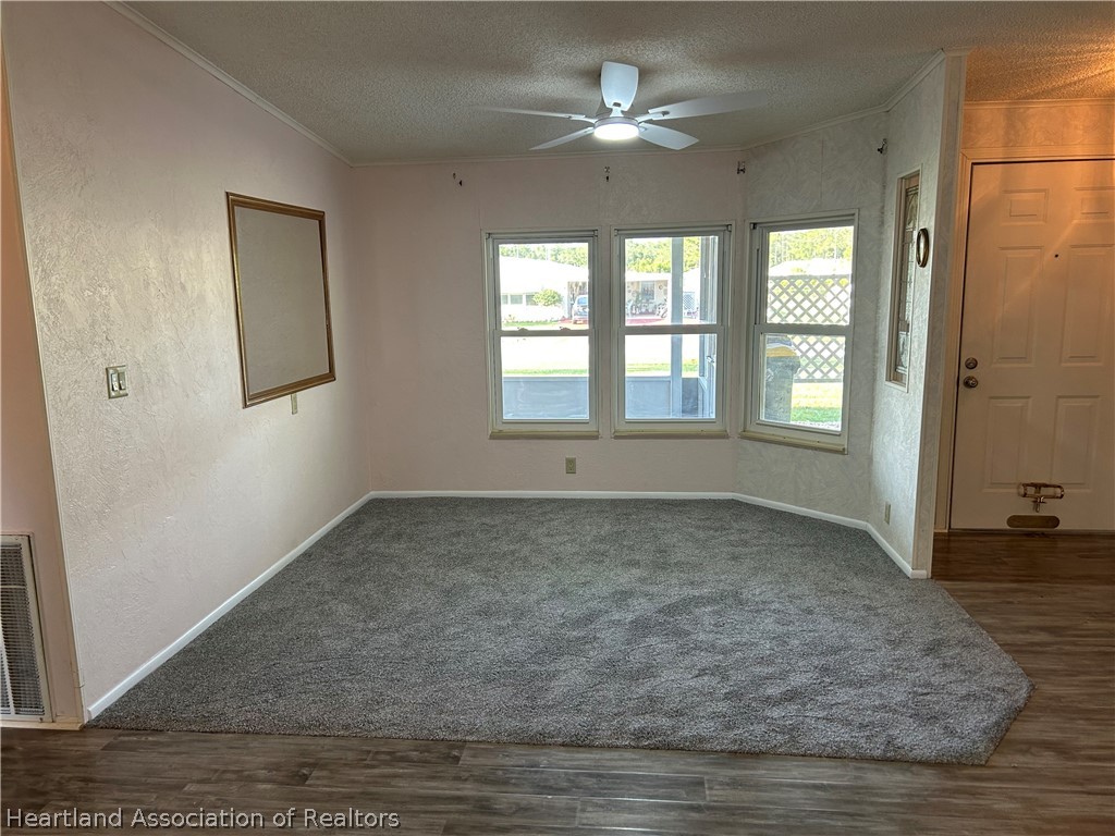 337 Hickory Ridge Drive Sebring, FL 33876 - Photo 40 of 48 wooden floor in an empty room with a window