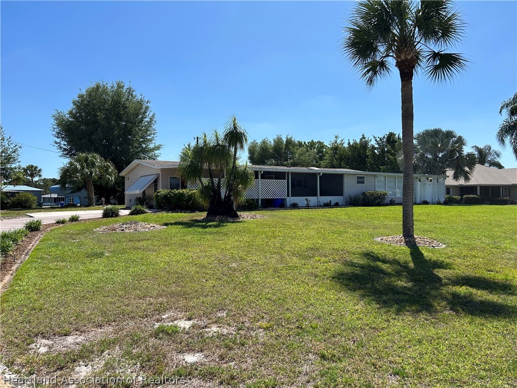 337 Hickory Ridge Drive Sebring, FL 33876 - Photo 4 of 48 a view of a garden with a slide