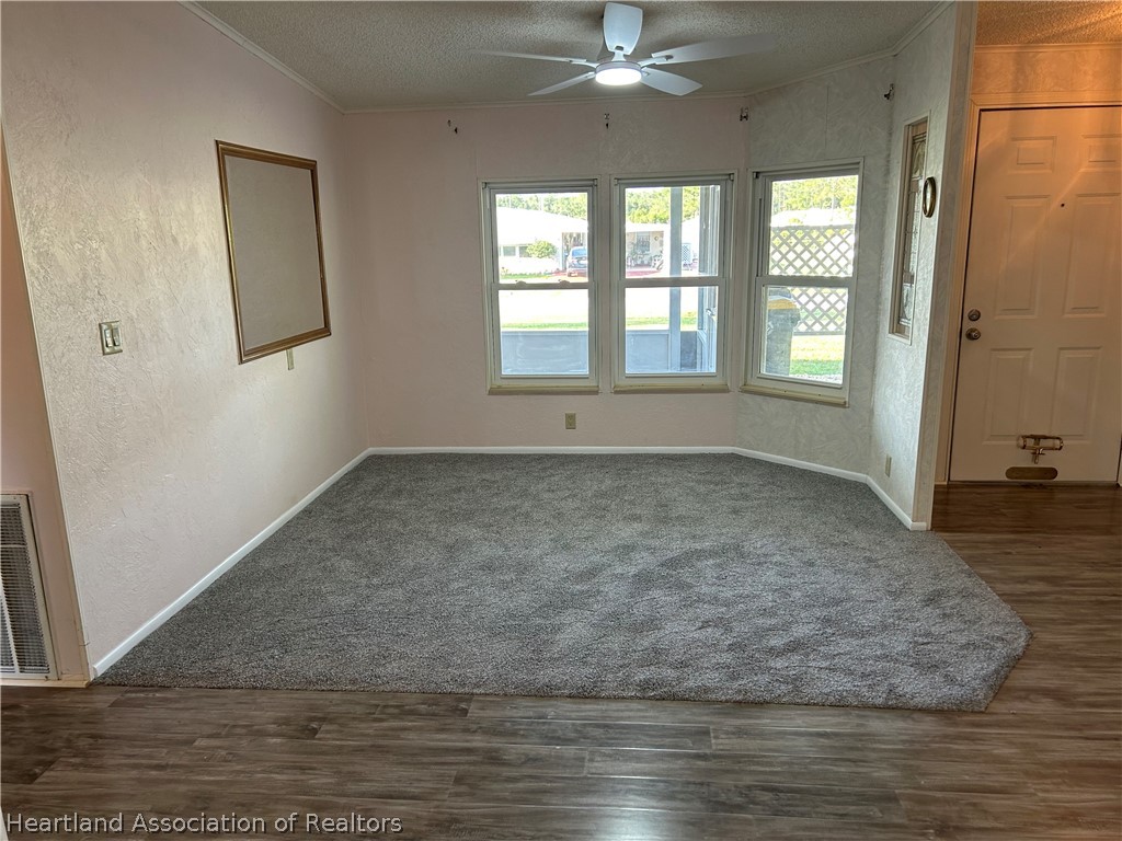 337 Hickory Ridge Drive Sebring, FL 33876 - Photo 41 of 48 a view of an empty room with wooden floor and a window