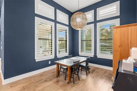 a bedroom with a bed lamp closet and large window