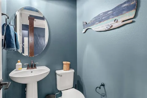 a bedroom with furniture and a chandelier