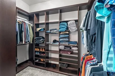 a view of an empty room with a ceiling fan