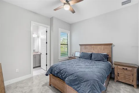 a bedroom with bed and a window