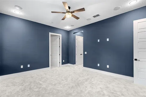 a view of a chairs and table in the balcony