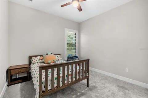 a view of a swimming pool and lounge chairs