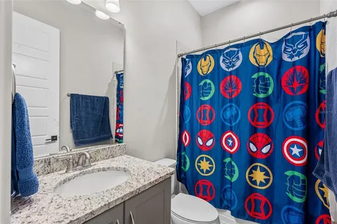 a view of swimming pool with chairs