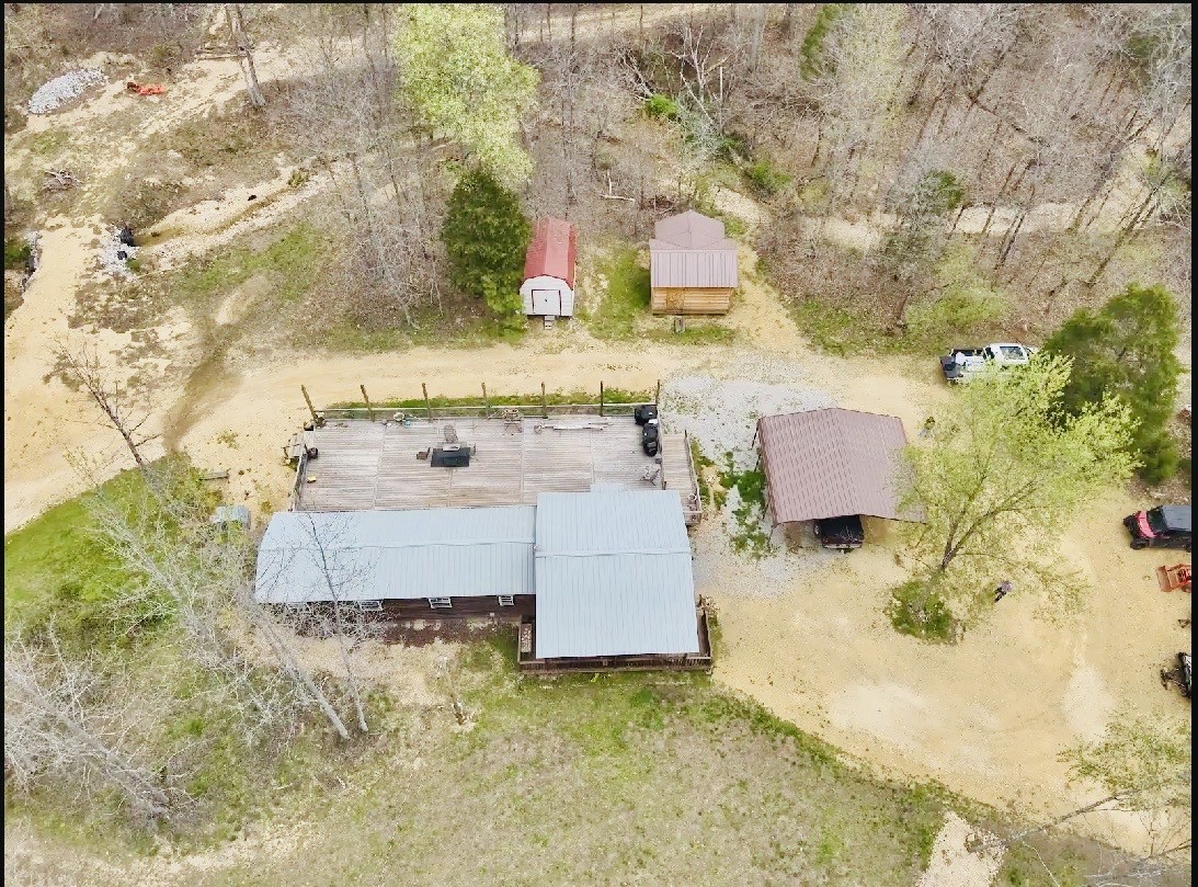 664 Russ Valley Road Lobelville, TN 37097 - Photo 2 of 57 a bathroom with a sink mirror and bathtub