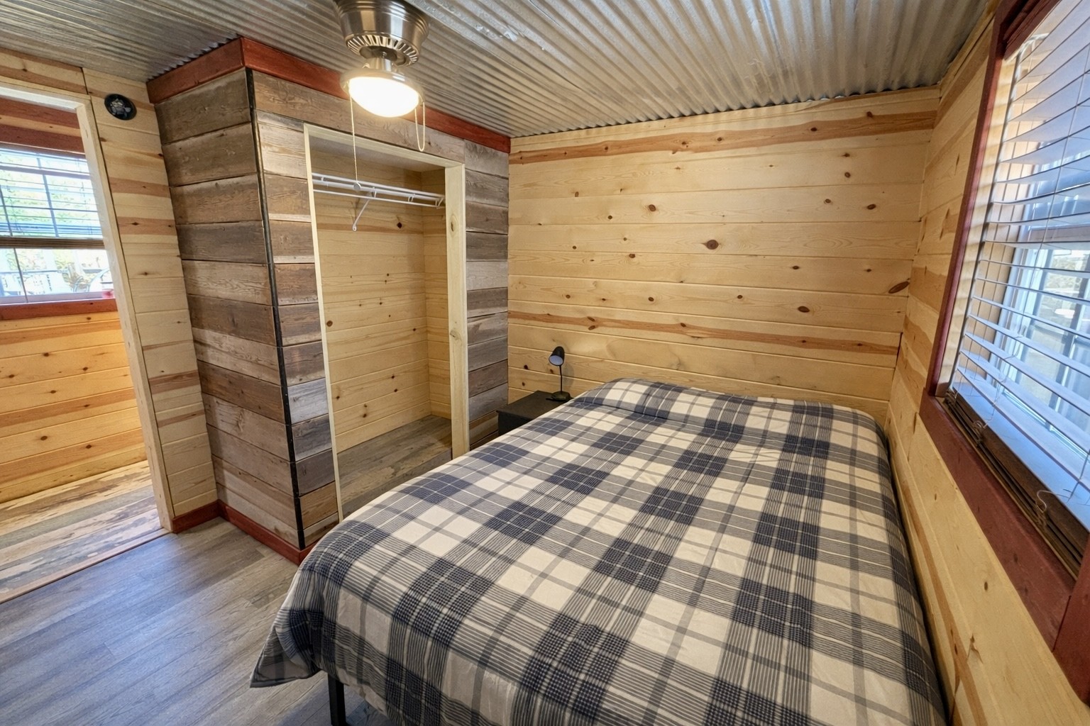 664 Russ Valley Road Lobelville, TN 37097 - Photo 33 of 57 a bedroom with a bed and a window