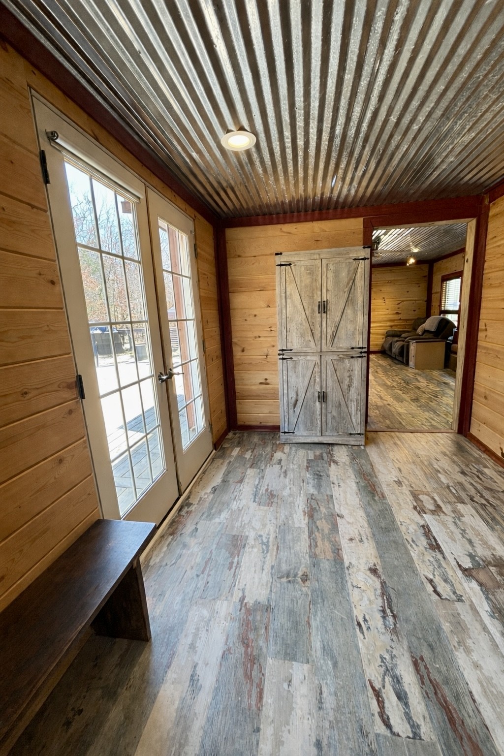 664 Russ Valley Road Lobelville, TN 37097 - Photo 40 of 57 a view of empty room with wooden floor and fan