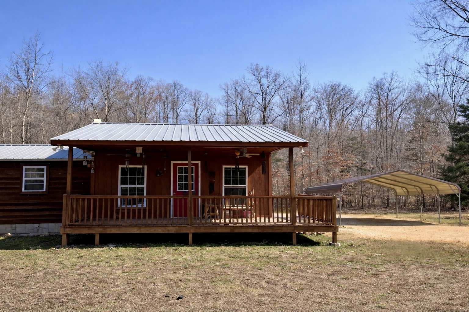 664 Russ Valley Road Lobelville, TN 37097 - Photo 4 of 57 a view of a house with a yard and sitting area