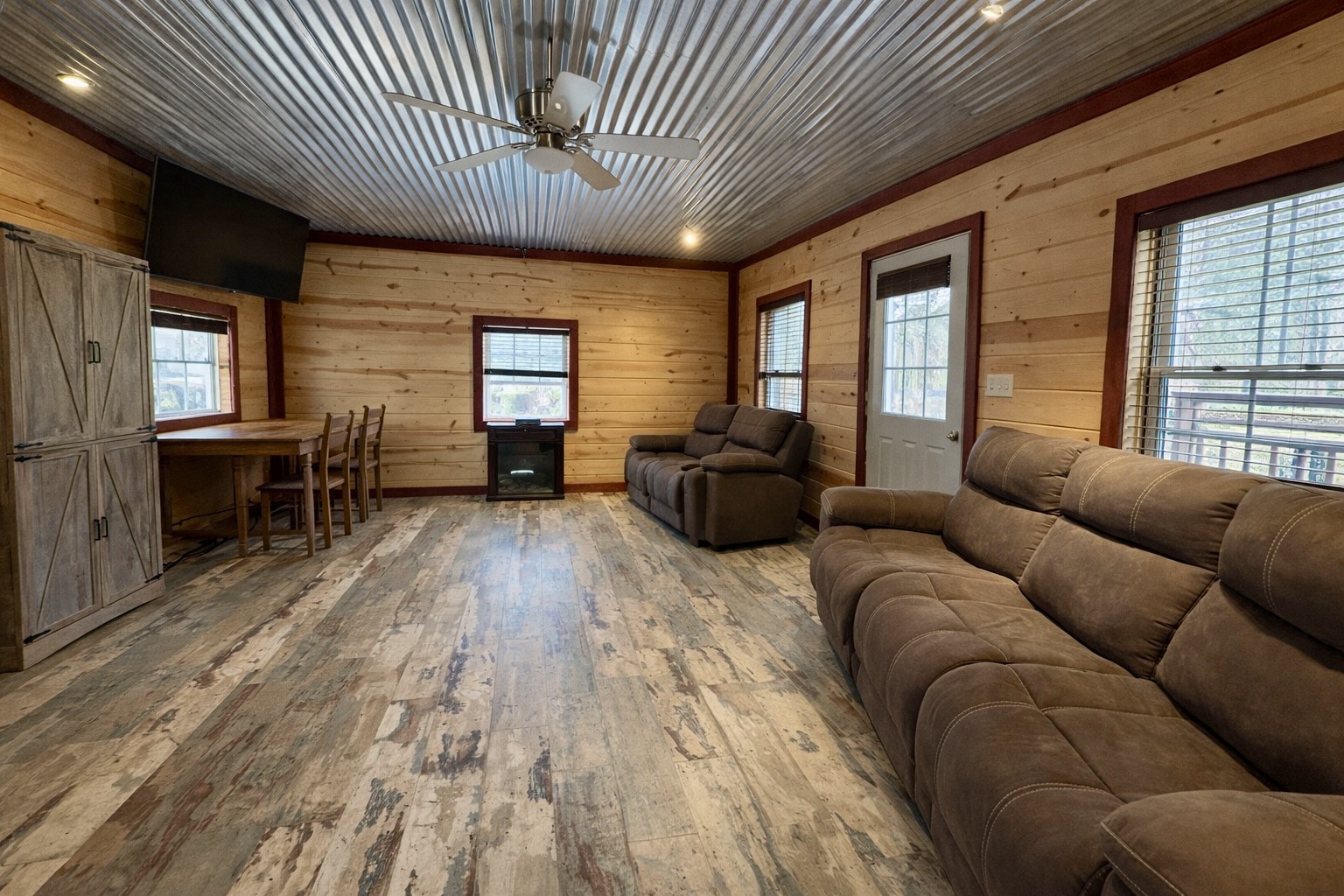664 Russ Valley Road Lobelville, TN 37097 - Photo 43 of 57 a living room with furniture and wooden floors