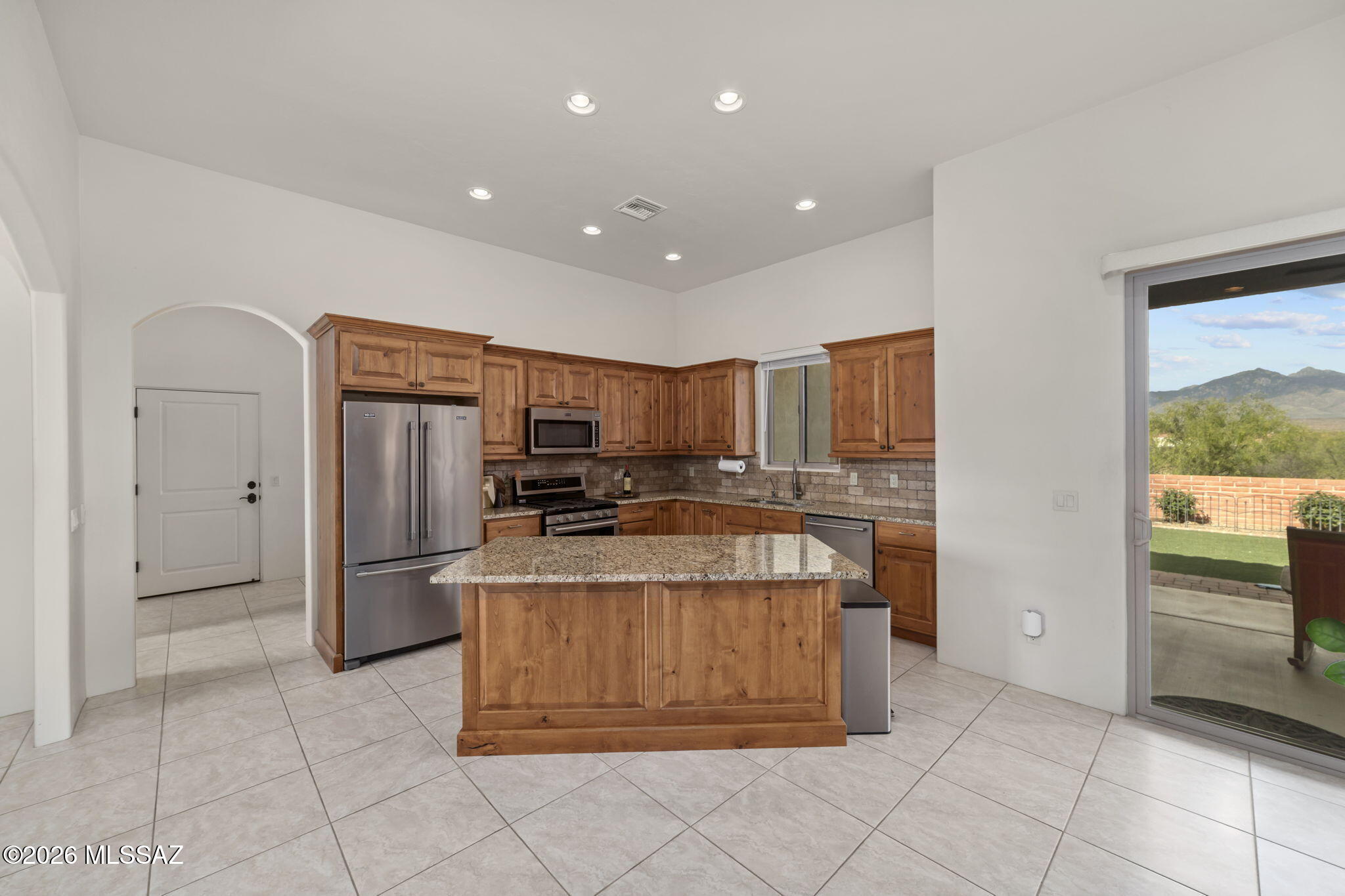 45 High View Court Tubac, AZ 85646 - Photo 16 of 44 a kitchen with stainless steel appliances granite countertop a refrigerator and a stove