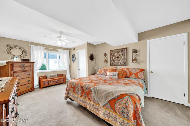 a bedroom with a bed and furniture