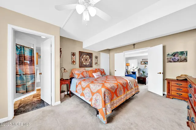 a bed room with a bed and a chandelier