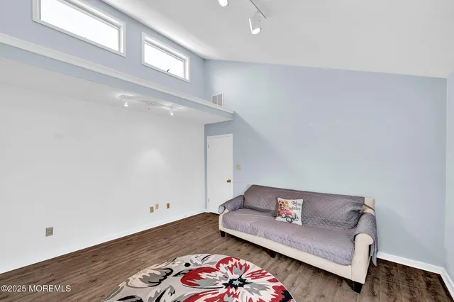 a living room with furniture and a rug