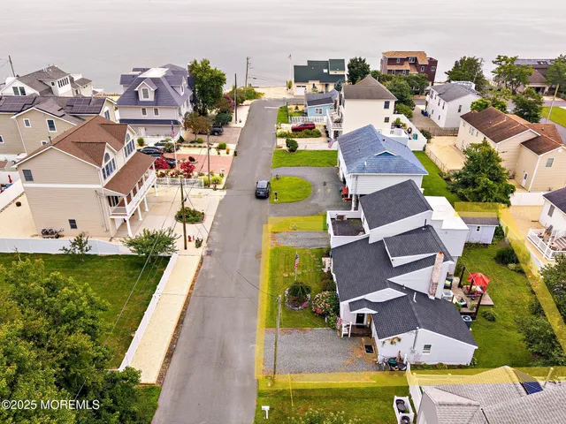an aerial view of a house with a garden