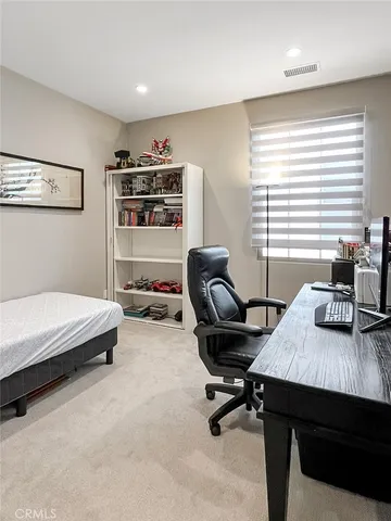 a workspace with furniture and window