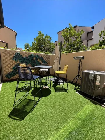 a view of a chairs in a backyard