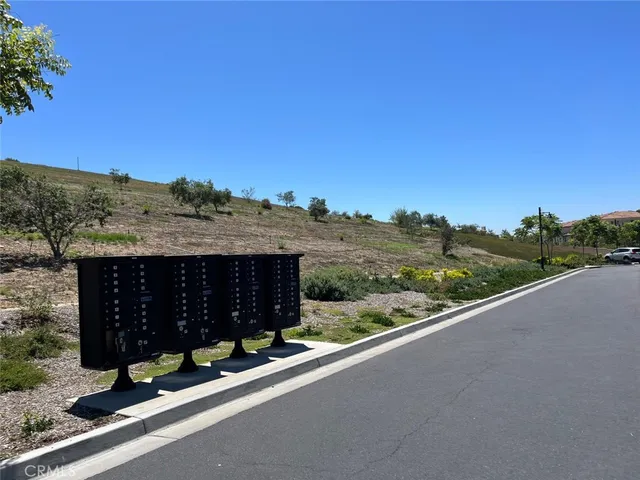 a view of a street with a ocean view