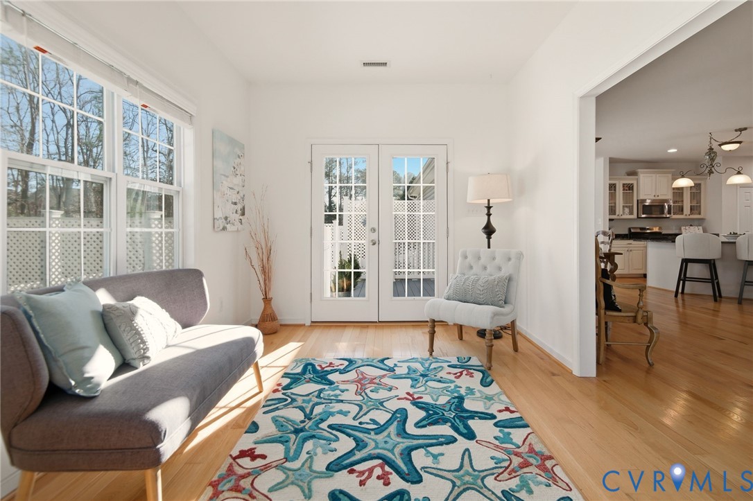 11201 Avening Road Midlothian, VA 23112 - Photo 11 of 20 a living room with furniture and a large window