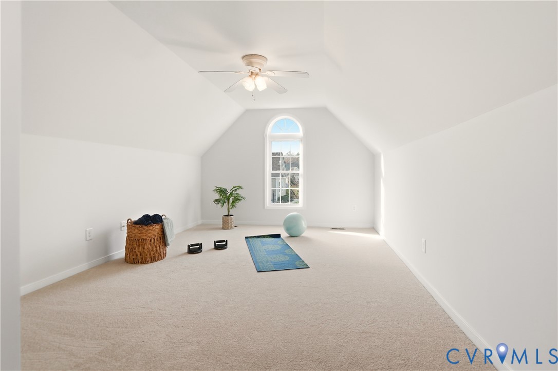 11201 Avening Road Midlothian, VA 23112 - Photo 14 of 20 a bedroom with a bed and a chandelier