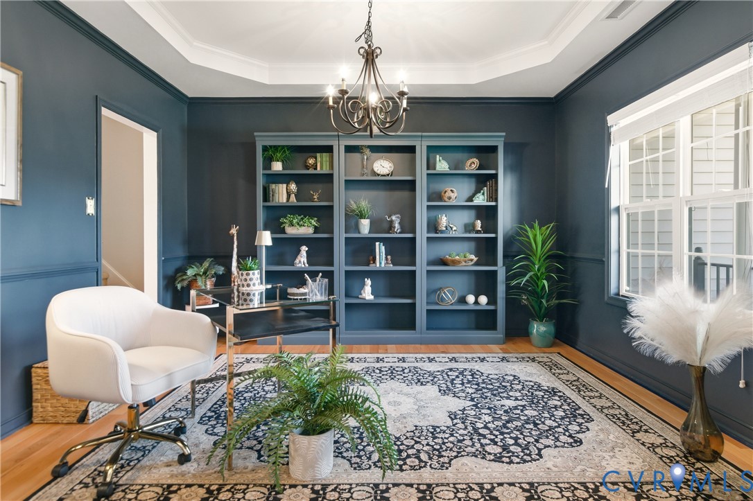 11201 Avening Road Midlothian, VA 23112 - Photo 3 of 20 a living room with furniture and a chandelier