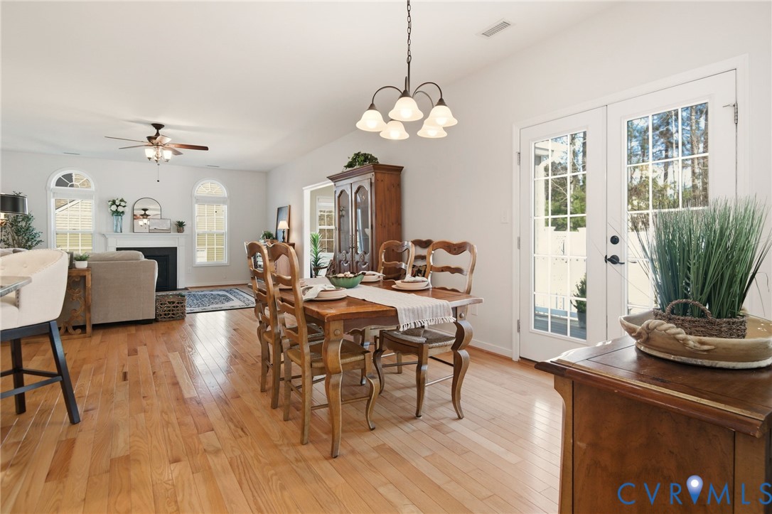 11201 Avening Road Midlothian, VA 23112 - Photo 5 of 20 a view of a dining room with furniture window and wooden floor