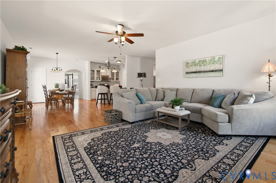 11201 Avening Road Midlothian, VA 23112 - Photo 9 of 20 a living room with furniture or couch and a dining table