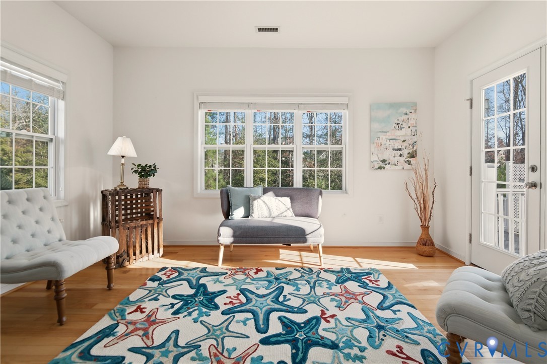 11201 Avening Road Midlothian, VA 23112 - Photo 10 of 20 a living room with furniture and a potted plant