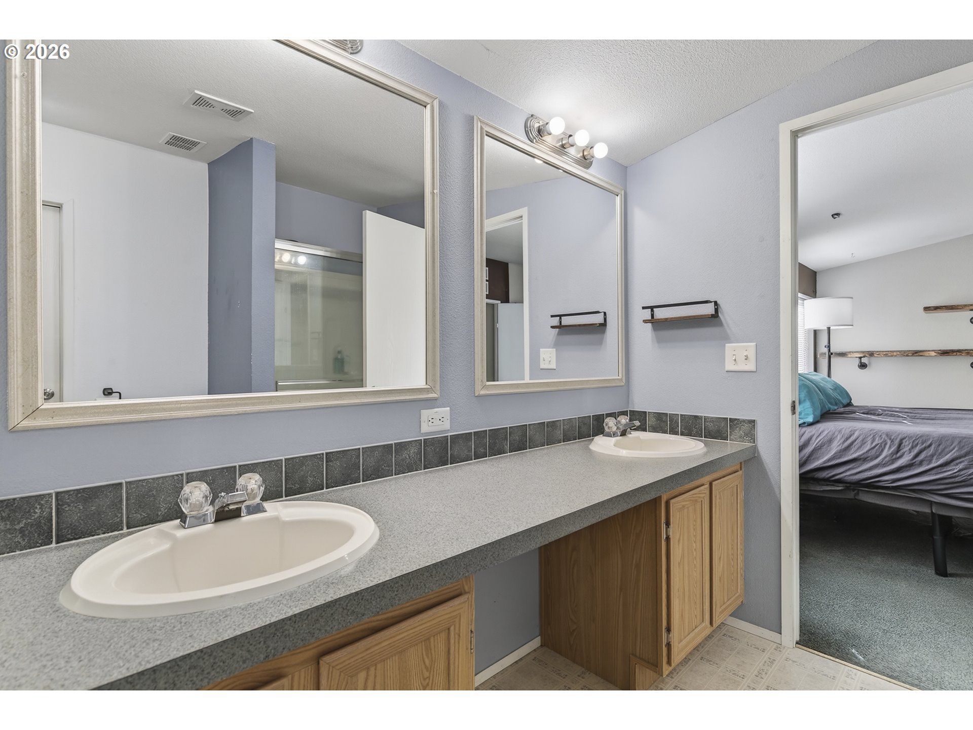 32700 Southeast Leewood Lane Boring, OR 97009 - Photo 31 of 44 a en suite bathroom with a sink and a mirror