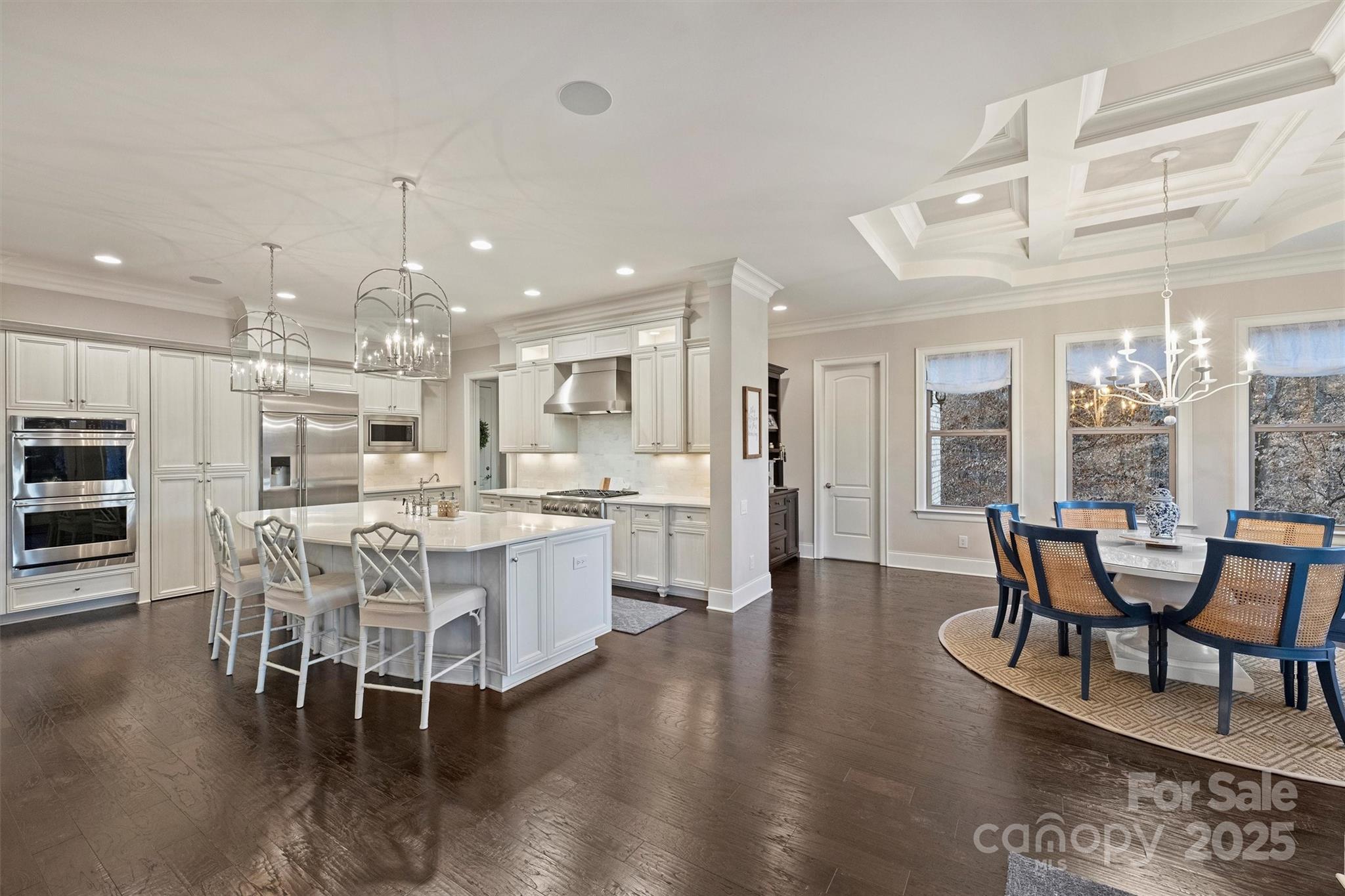 17639 Stuttgart Road Davidson, NC 28036 - Photo 18 of 48 a dining area with stainless steel appliances kitchen island granite countertop a dining table chairs and view living room