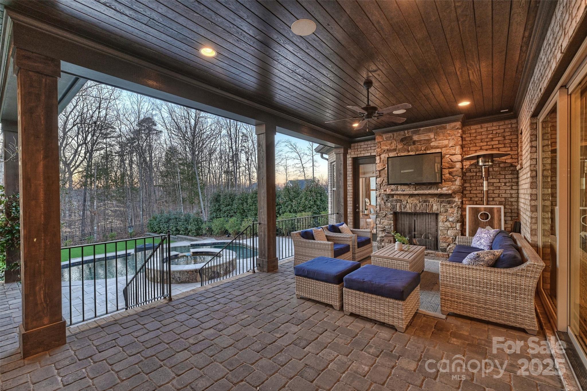 17639 Stuttgart Road Davidson, NC 28036 - Photo 40 of 48 a outdoor living space with furniture and a fireplace