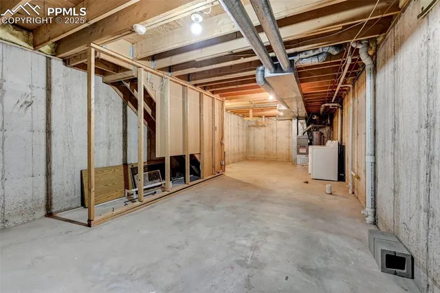 a view of an empty room with wooden walls