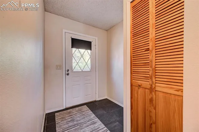 a view of a bedroom from the hallway