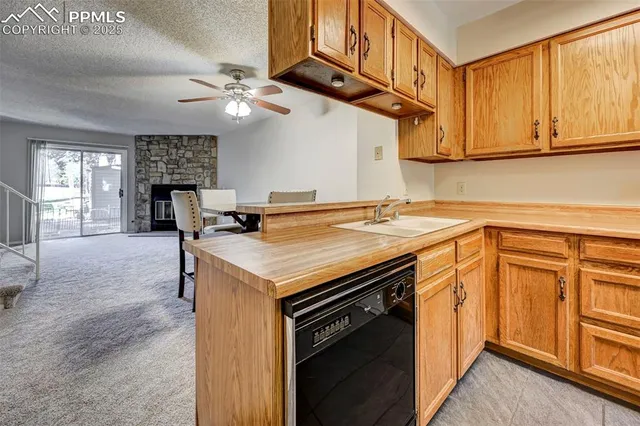 a kitchen with stainless steel appliances granite countertop a sink and cabinets