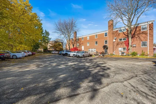 a view of street with parked cars