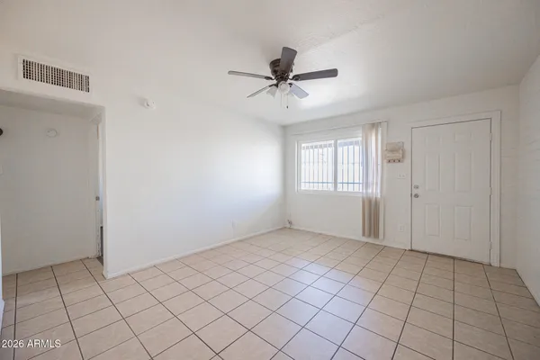 a view of an empty room and window