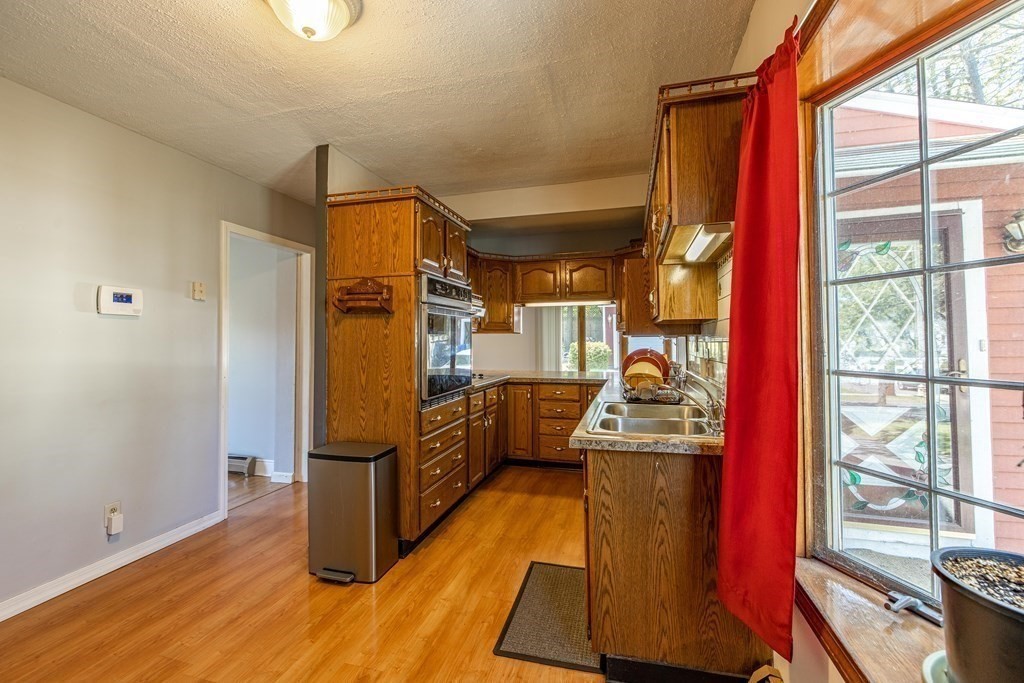 160 Pasco Road Springfield, MA 01151 - Photo 8 of 33 a kitchen with stainless steel appliances granite countertop a stove a refrigerator and a refrigerator