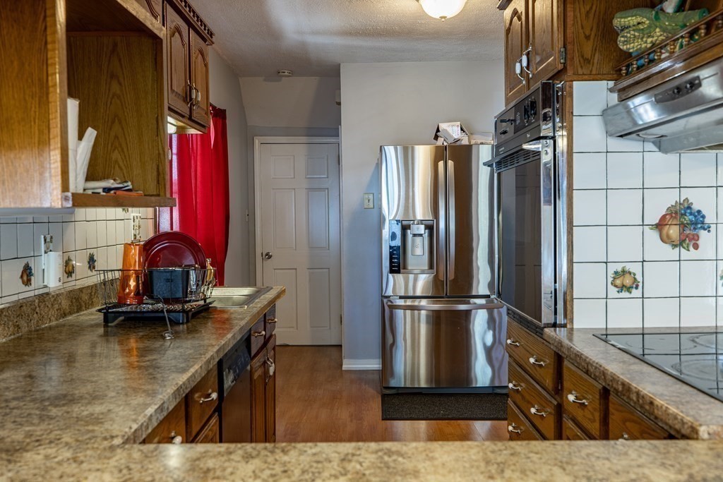 160 Pasco Road Springfield, MA 01151 - Photo 10 of 33 a kitchen with stainless steel appliances granite countertop a refrigerator and a stove