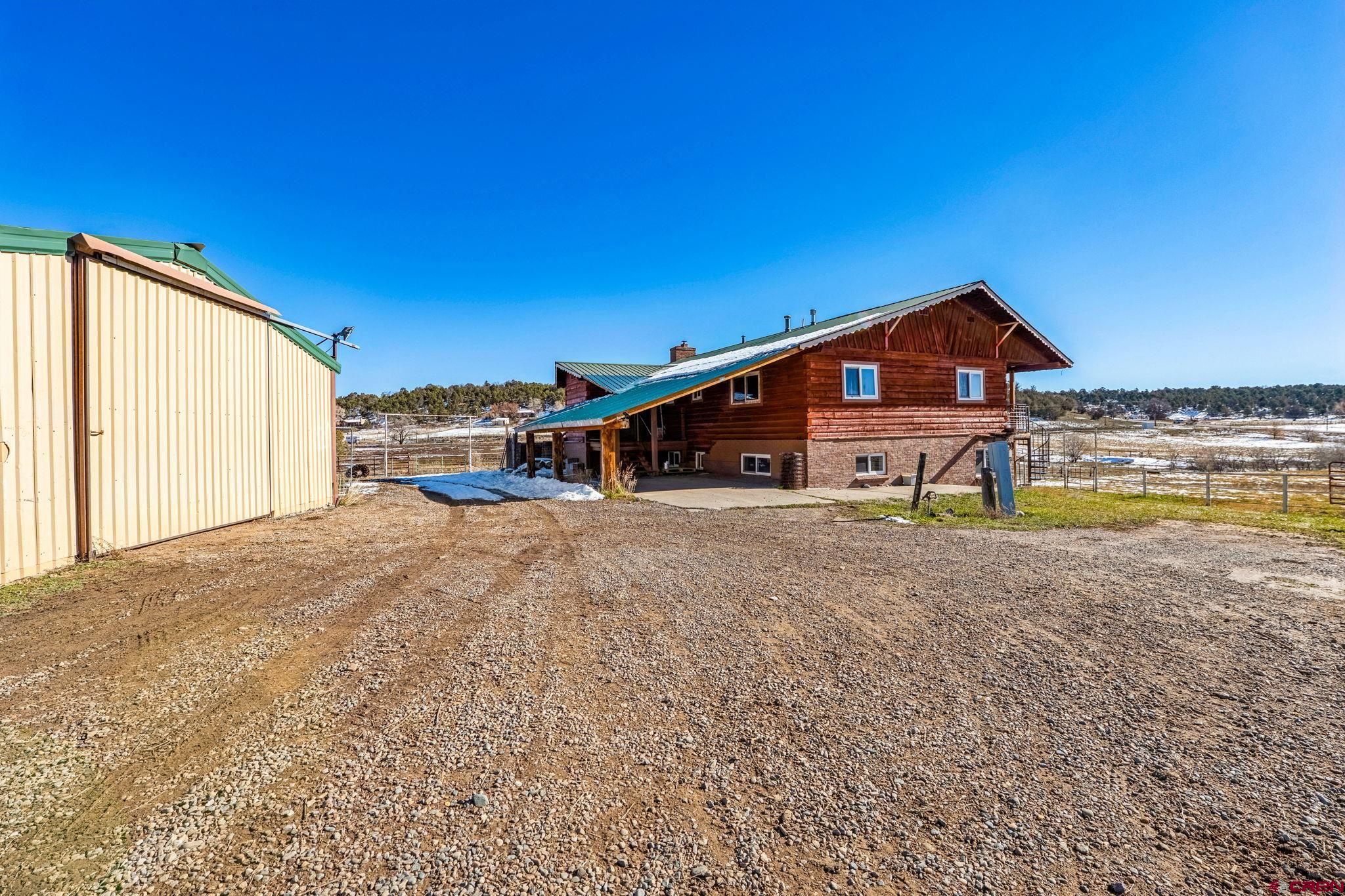 124 Meadow Road Ignacio, CO 81137 - Photo 12 of 37 a view of a house with a yard