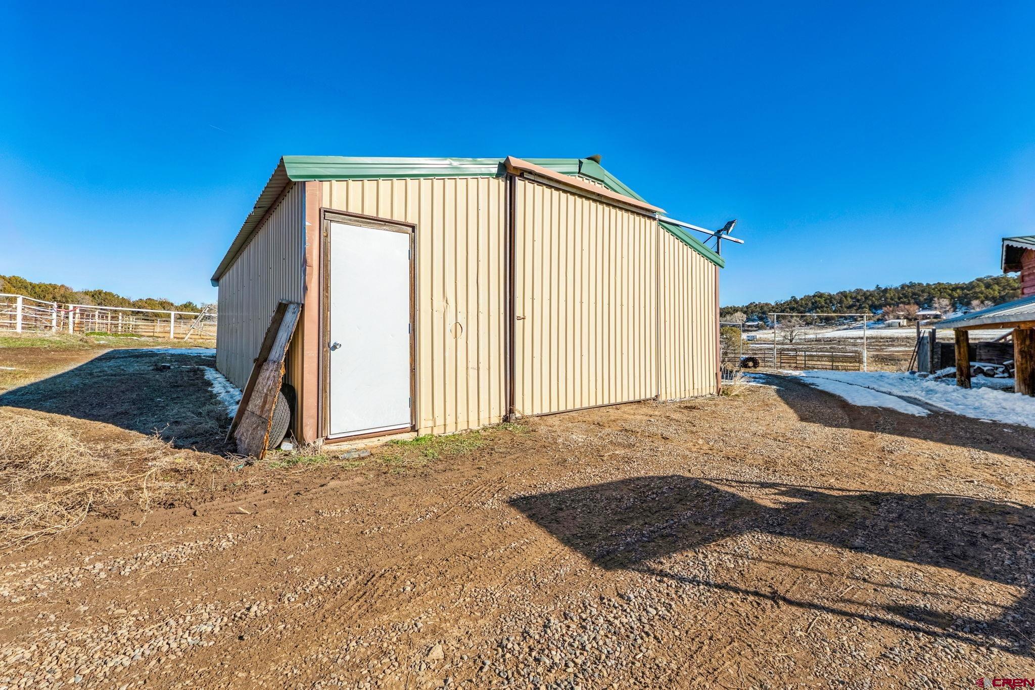 124 Meadow Road Ignacio, CO 81137 - Photo 13 of 37 a view of backyard with garage