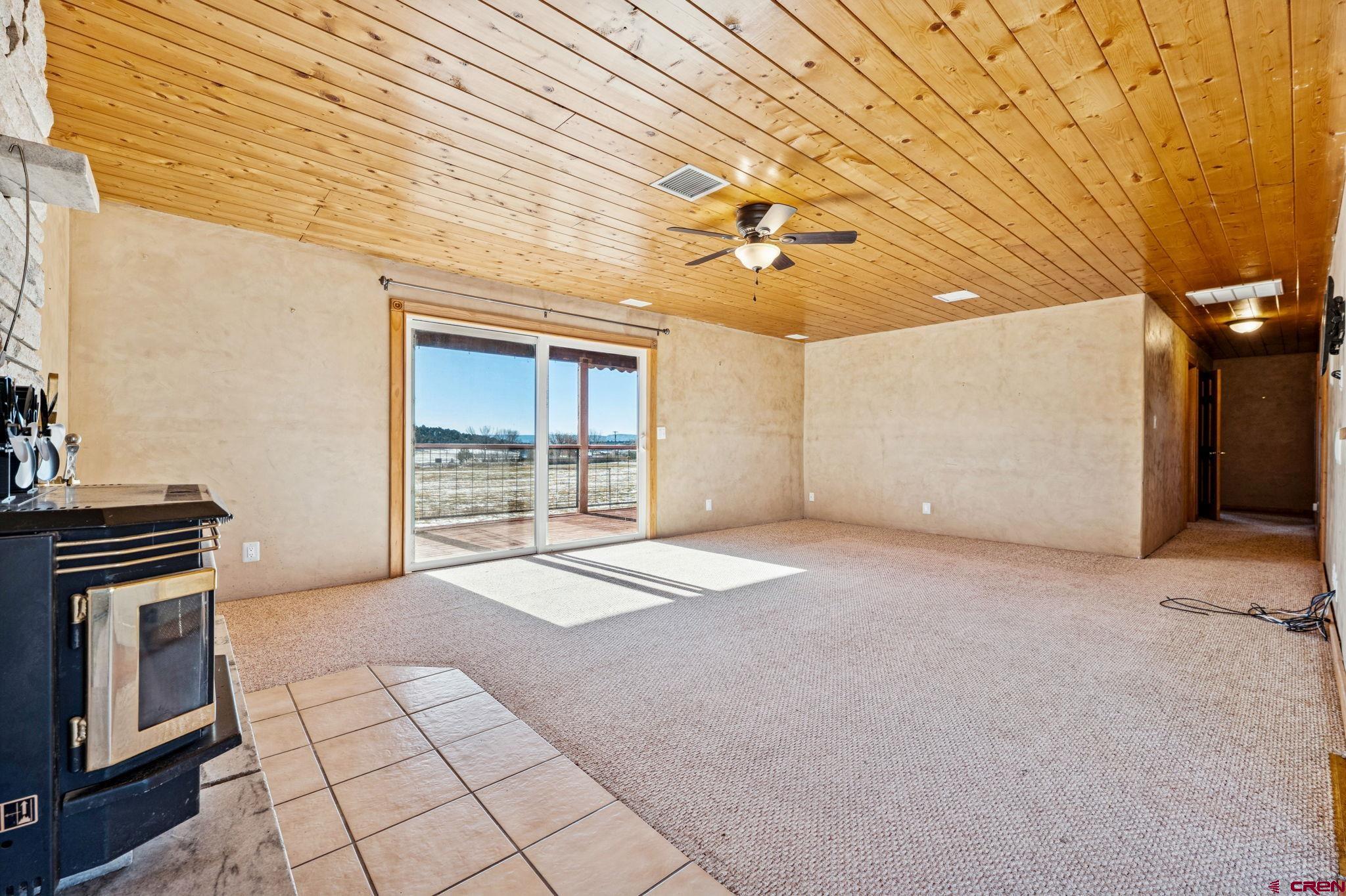 124 Meadow Road Ignacio, CO 81137 - Photo 22 of 37 a view of an empty room with a fireplace
